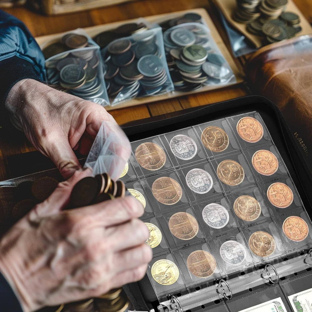 Coin holder album with clear pockets as hands place coins into the pages.