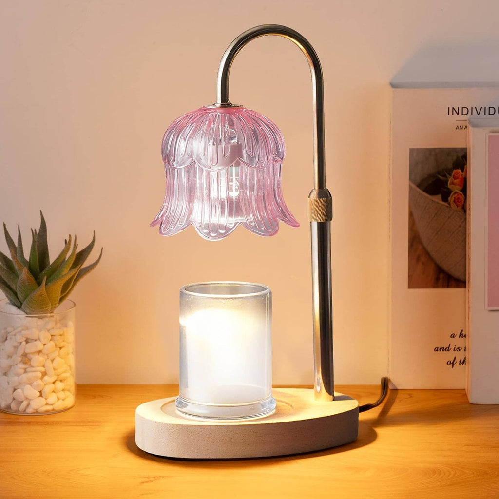 Pink glass flower candle warmer lamp with arched metal stand and wooden base