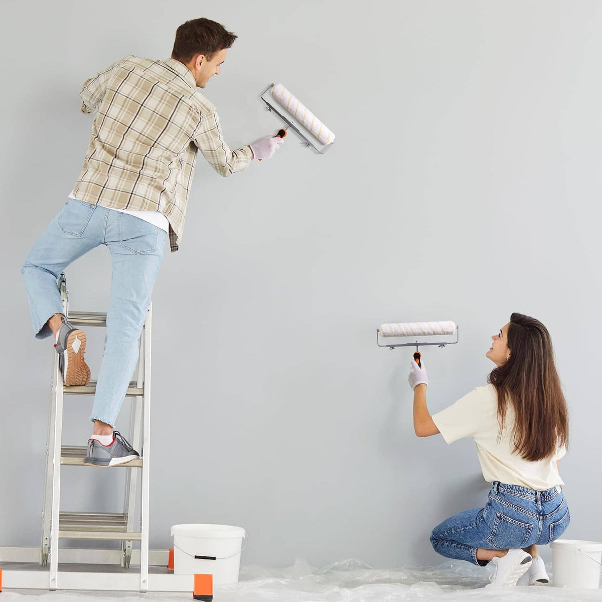 Microfiber paint roller covers showing use on walls, white with yellow stripe bands (3 pack)
