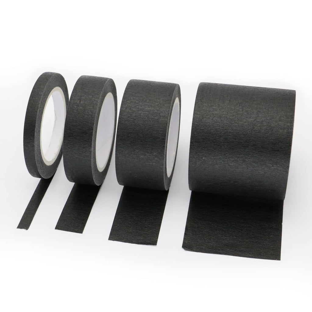 Black painters masking tape rolls with loose strip ends