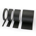 Black painters masking tape rolls with loose strip ends