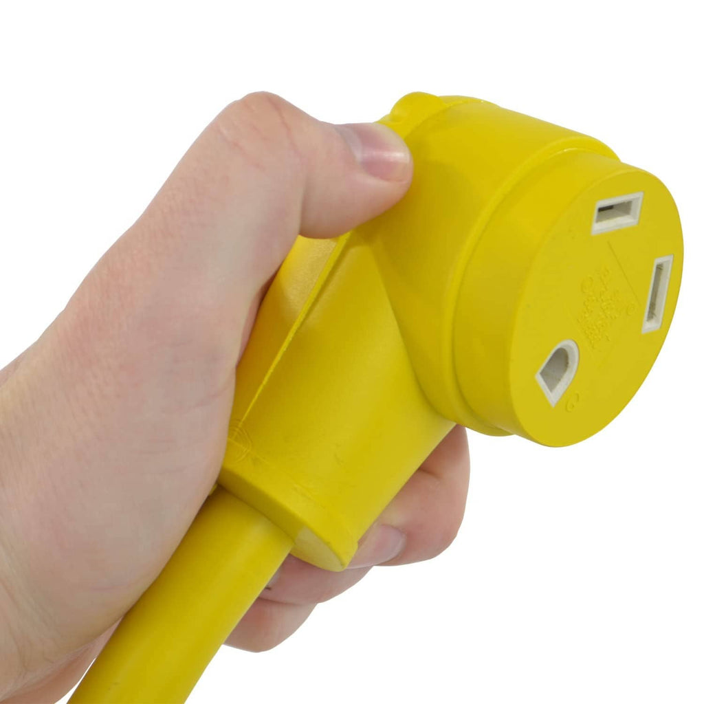 Yellow 30 Amp locking male plug adapter held in hand, showing prongs