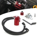 Red oil catch can tank kit with black hoses, clamps, fittings, and filter