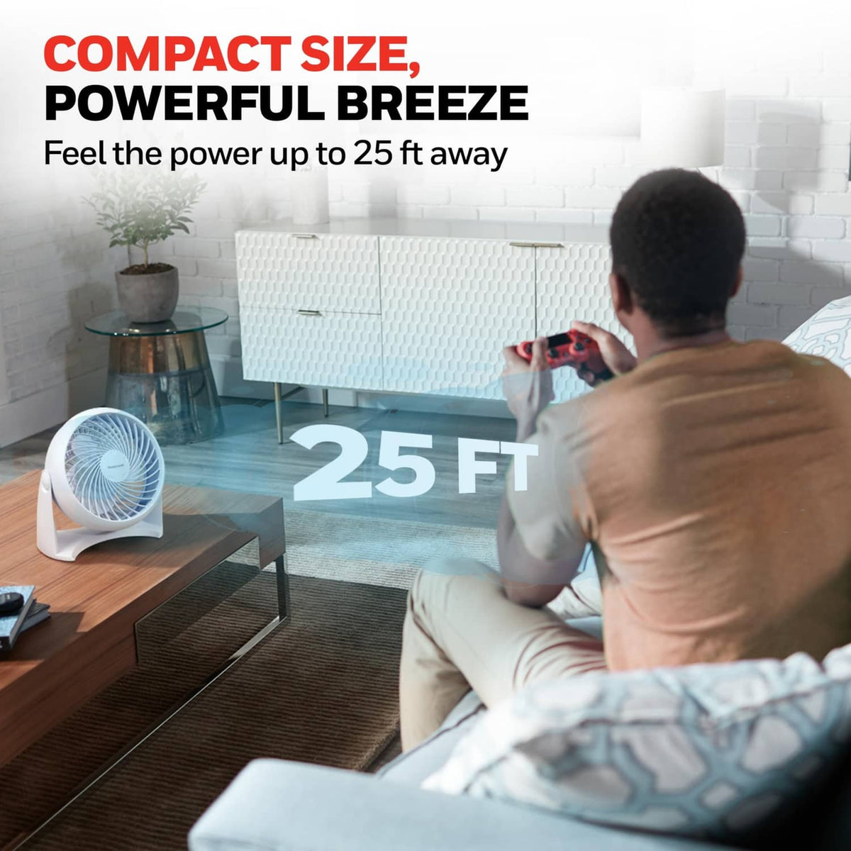 Compact white tabletop fan with front grille, angled forward for airflow