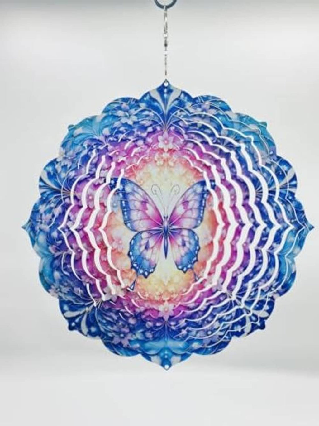 Round butterfly wind spinner in blue, pink, and purple tones with hanging chain