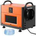 Commercial dehumidifier orange unit with digital display, fan outlet, and drain hose included.