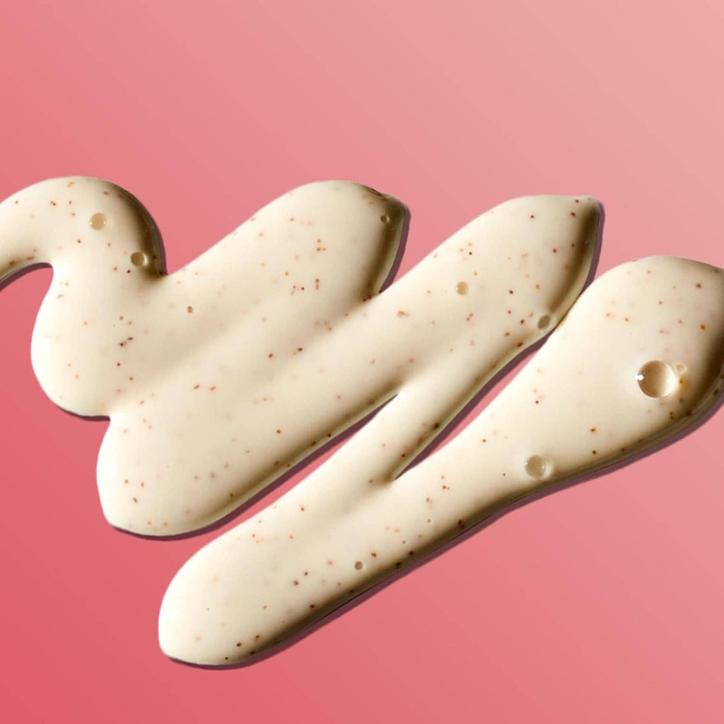Coconut butter body scrub cream swirls with light tan speckles