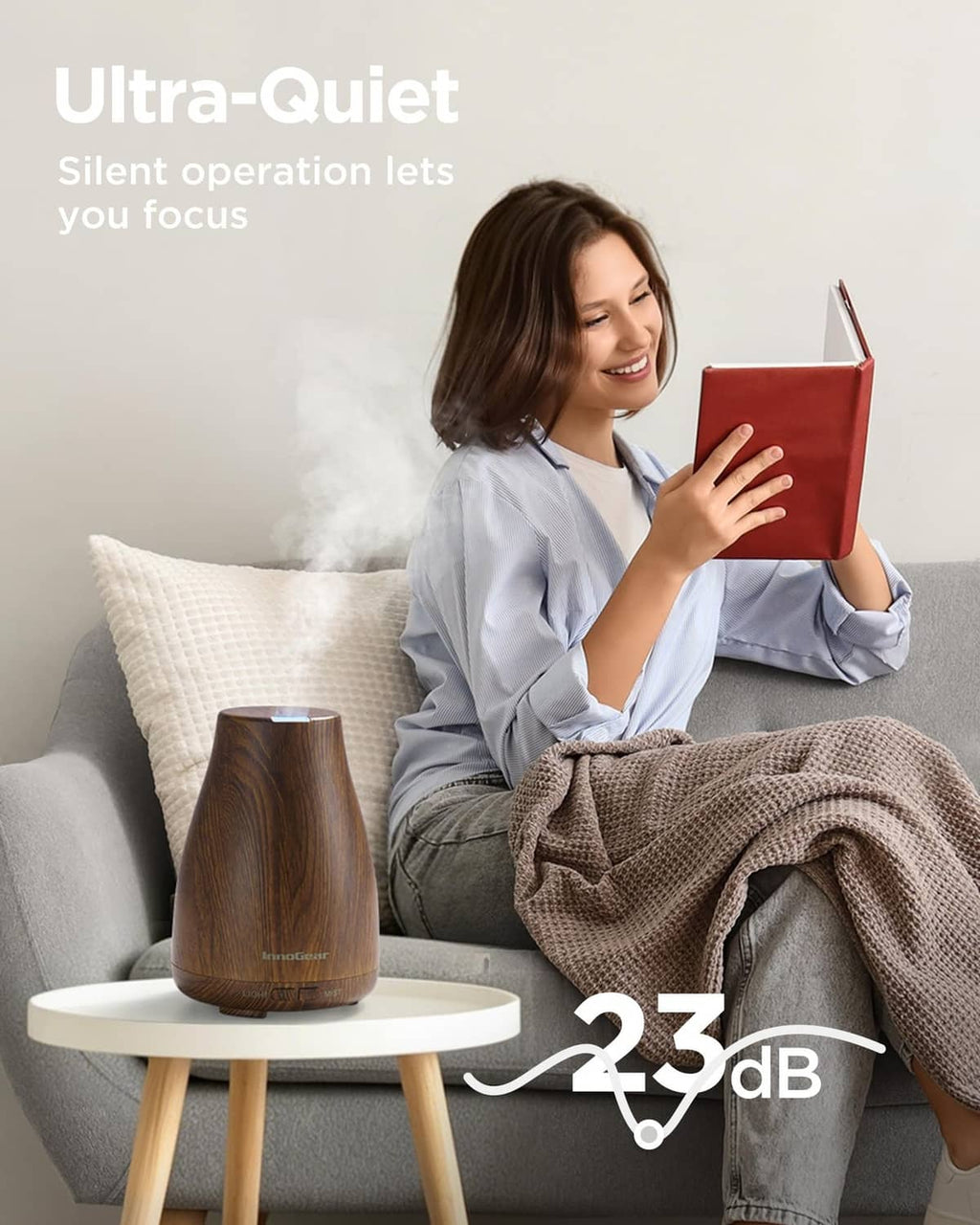 Bronze wood-grain essential oil diffuser emitting mist, compact cone shape on base