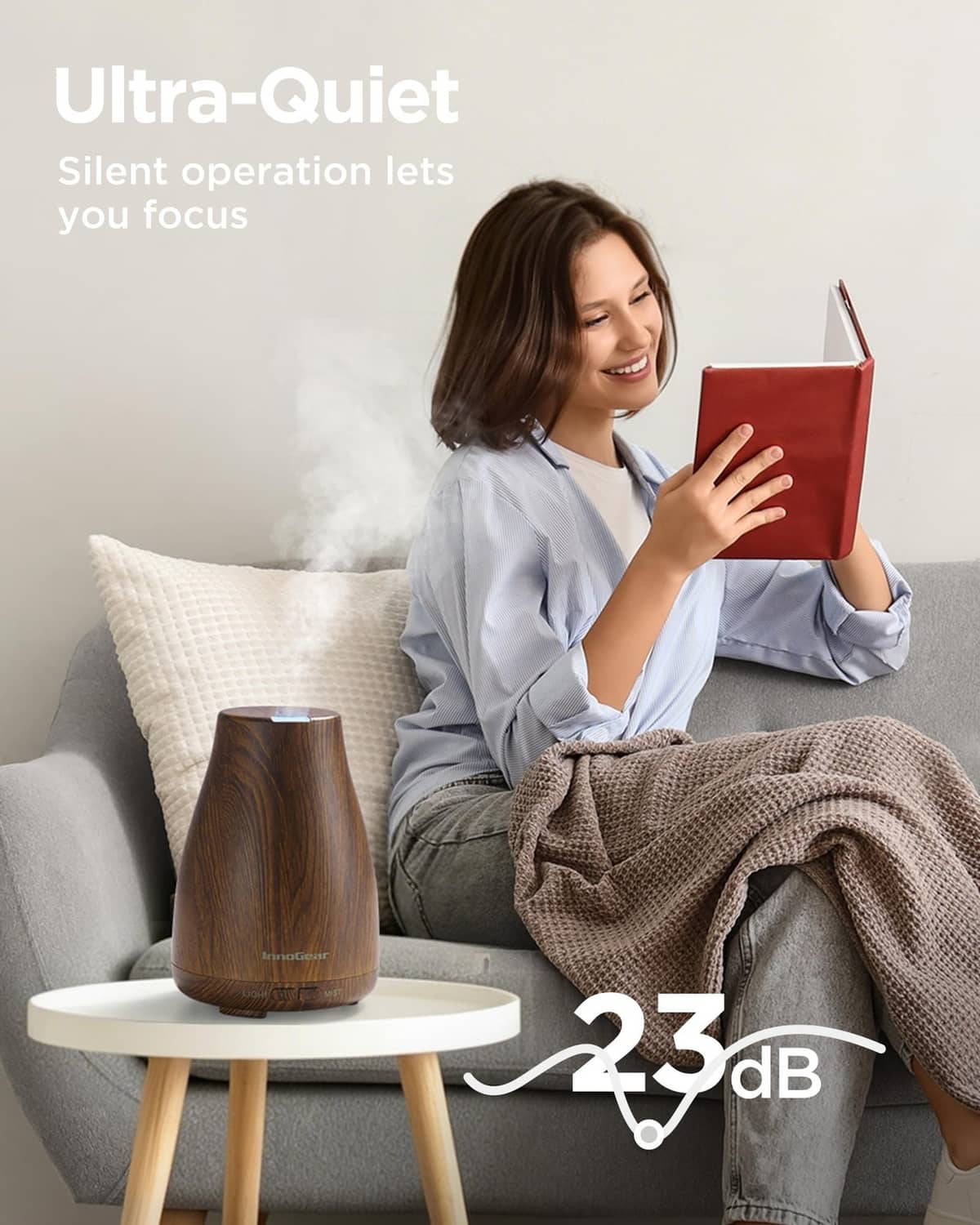 Bronze wood-grain essential oil diffuser emitting mist, compact cone shape on base