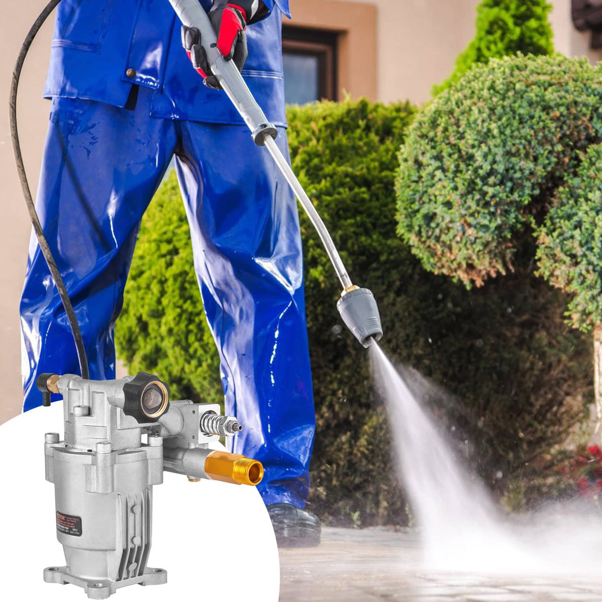 Pressure washer pump with spray wand cleaning hedges, hose connected to the unit