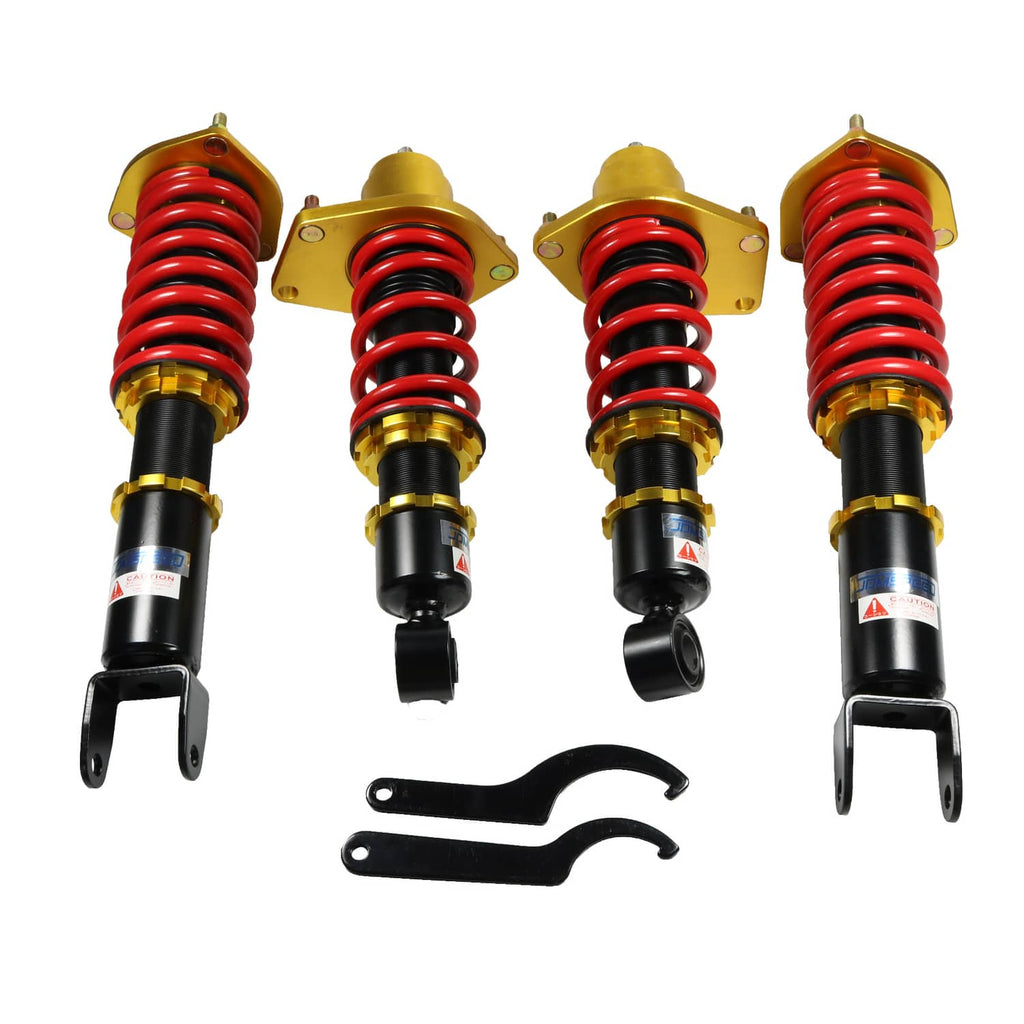 Adjustable coilover shock strut set with red springs, black housings, and gold top plates