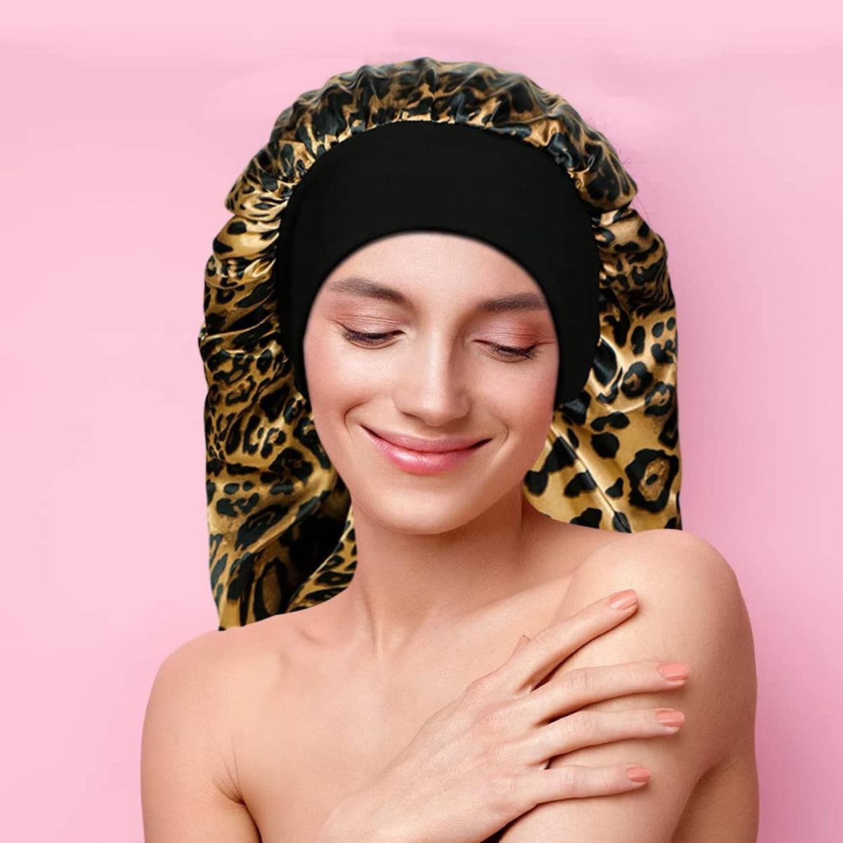 Leopard print satin sleep bonnet hood with black inner band, worn by woman