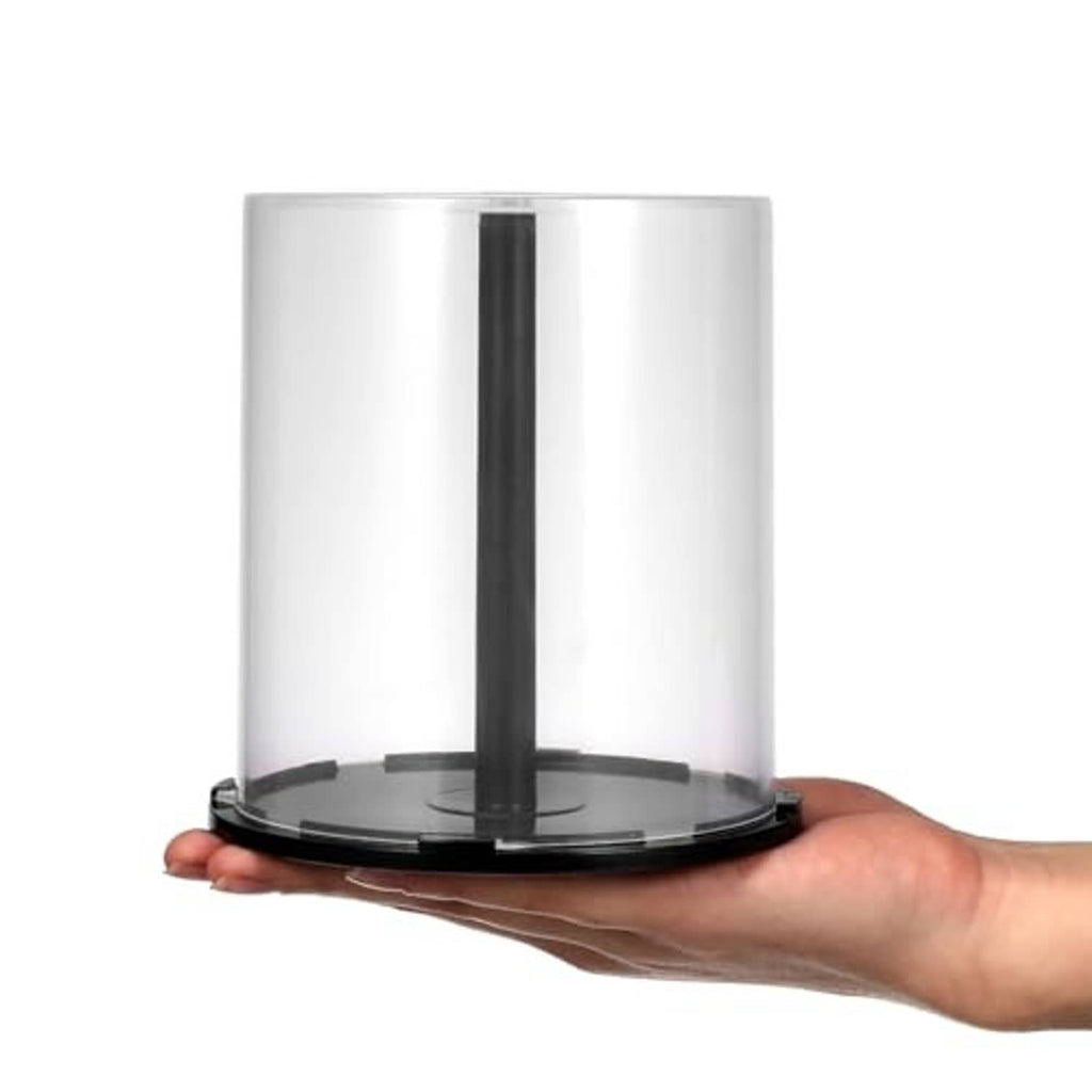 Clear CD/DVD spindle storage case with central hub and dark base ring, held in hand