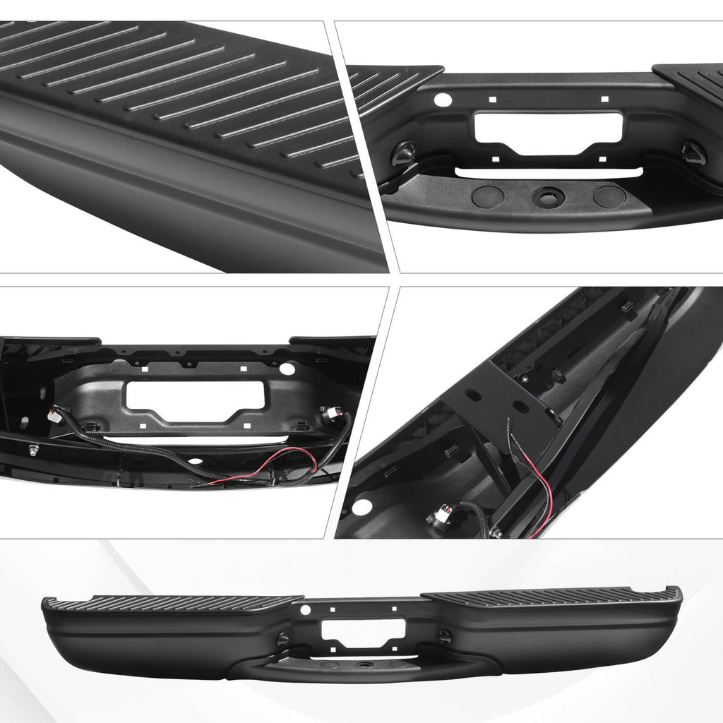 Black rear step bumper cover with textured tread and underside mounting details