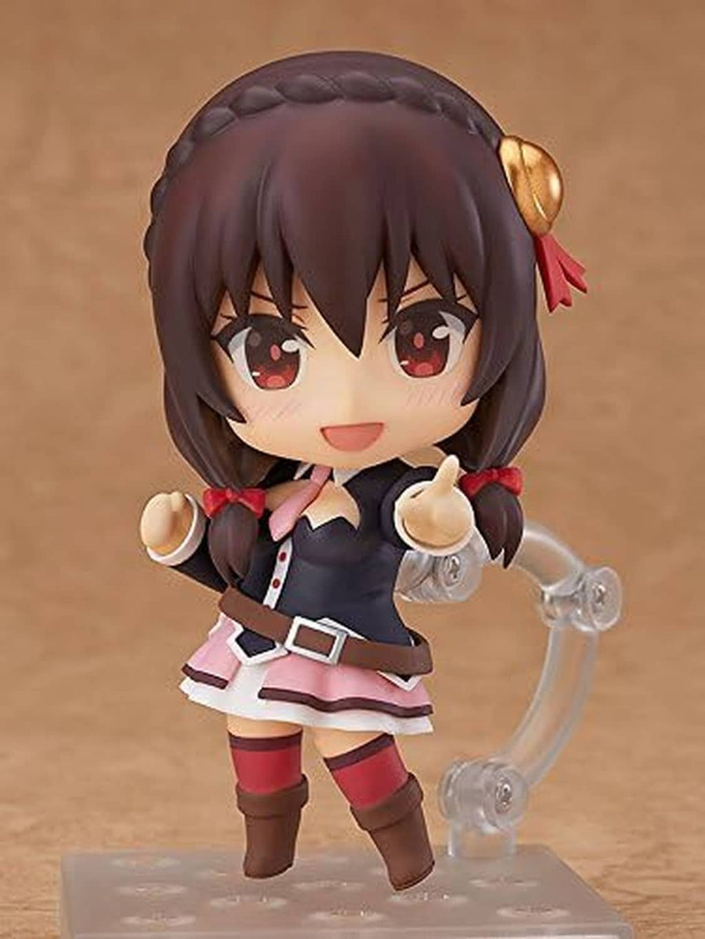 Chibi Nendoroid figure with clear bubble-like accessory; dark hair, red eyes, pink skirt.