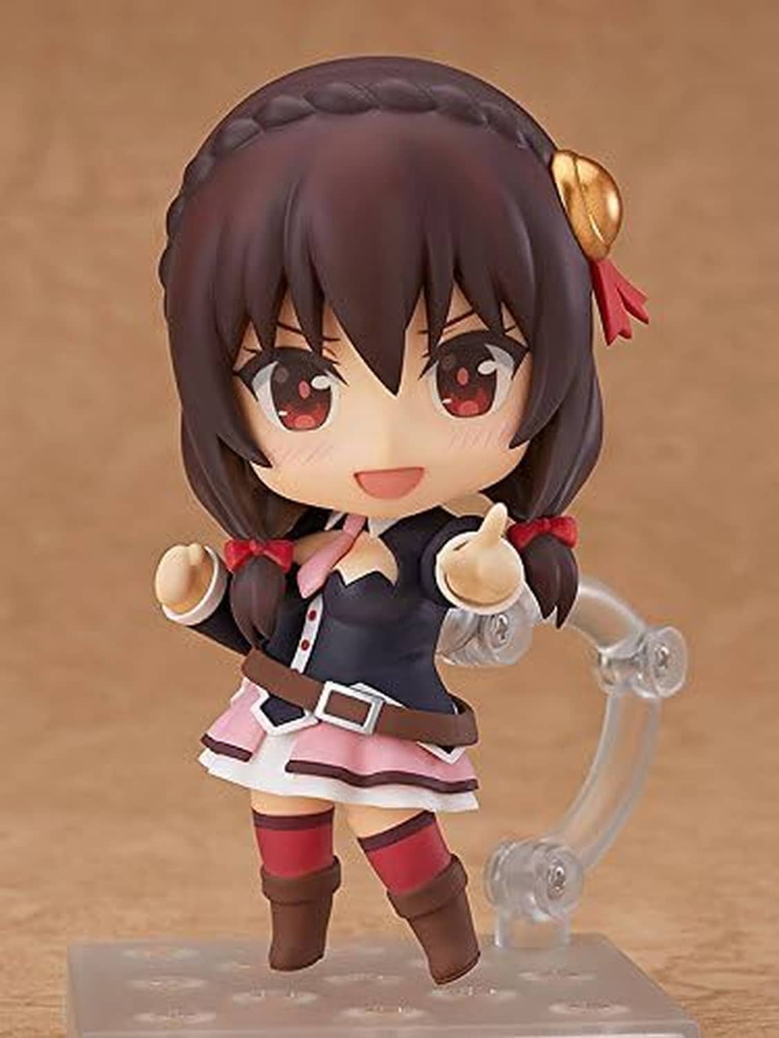 Chibi Nendoroid figure with clear bubble-like accessory; dark hair, red eyes, pink skirt.