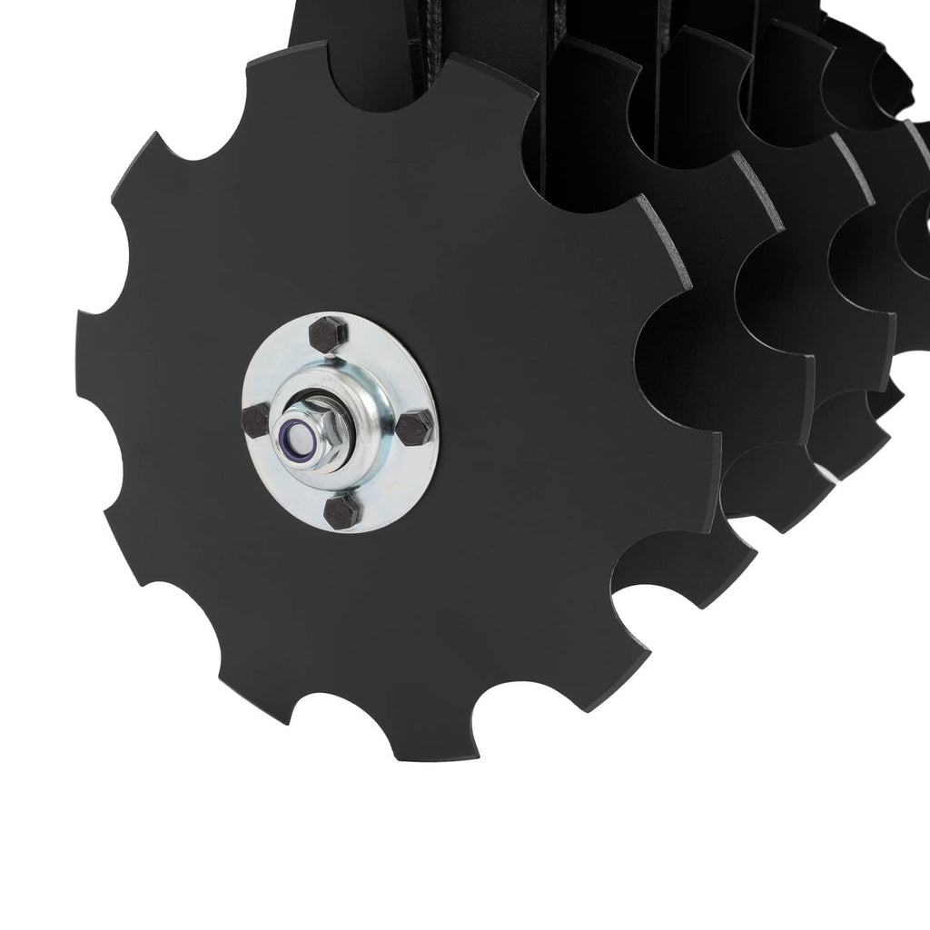 Notched steel disc blade with center hub and mounting nut on disc harrow