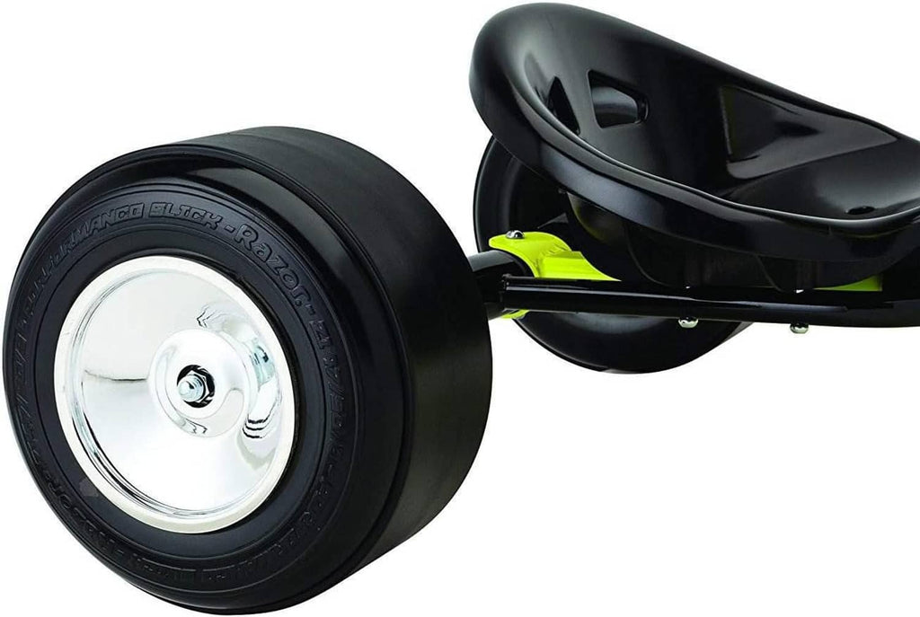 Front caster wheel and black seat detail on a yellow-and-black drift trike