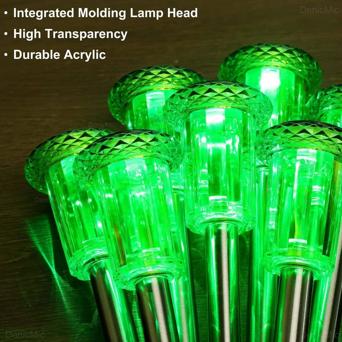 Cluster of green solar stake light heads with clear acrylic design and bright glow