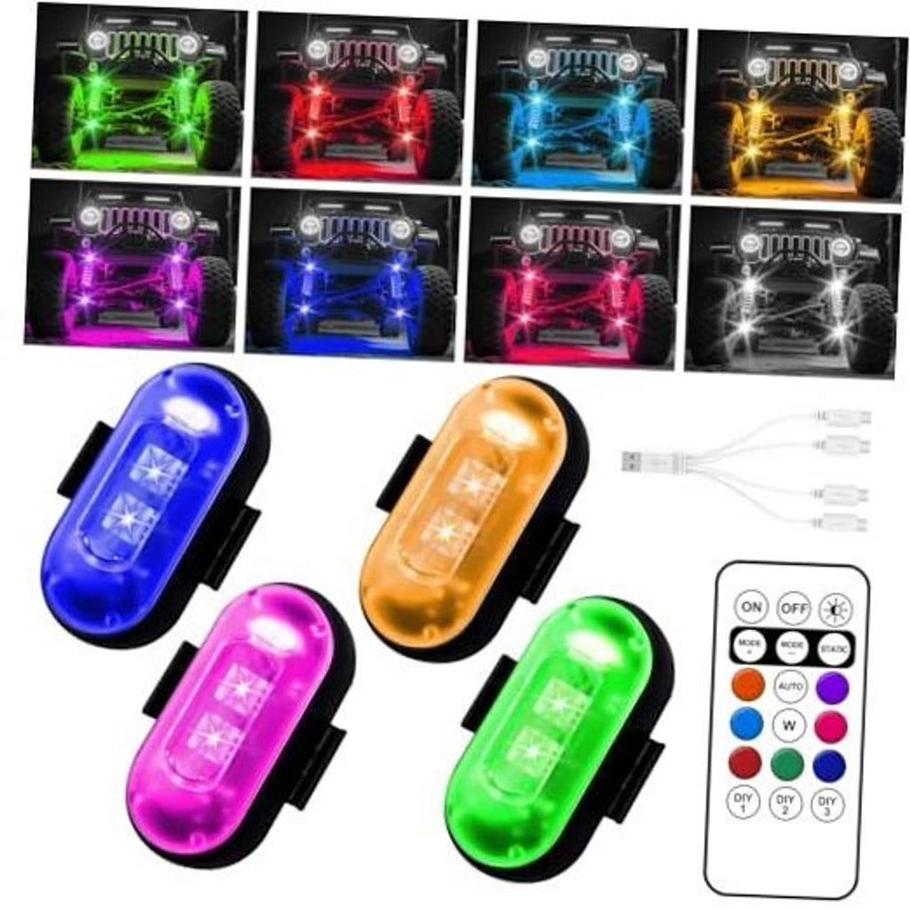 Set of four wireless LED rock lights glowing in green, red, blue, and yellow