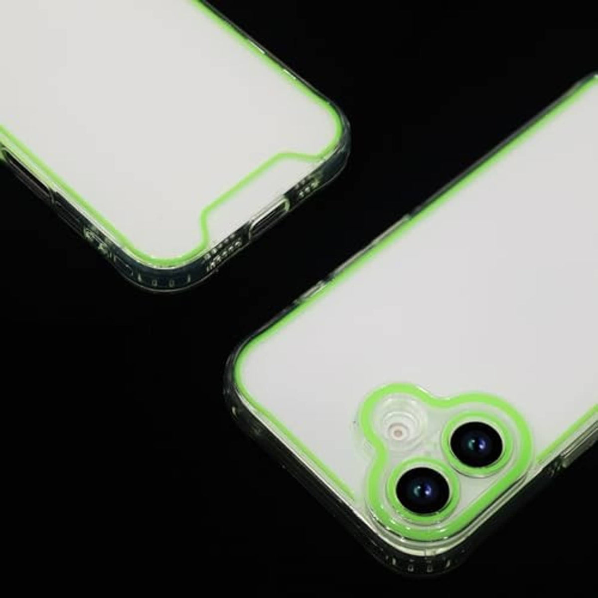 Close-up: green clear phone case corner with glowing trim and dual camera openings.