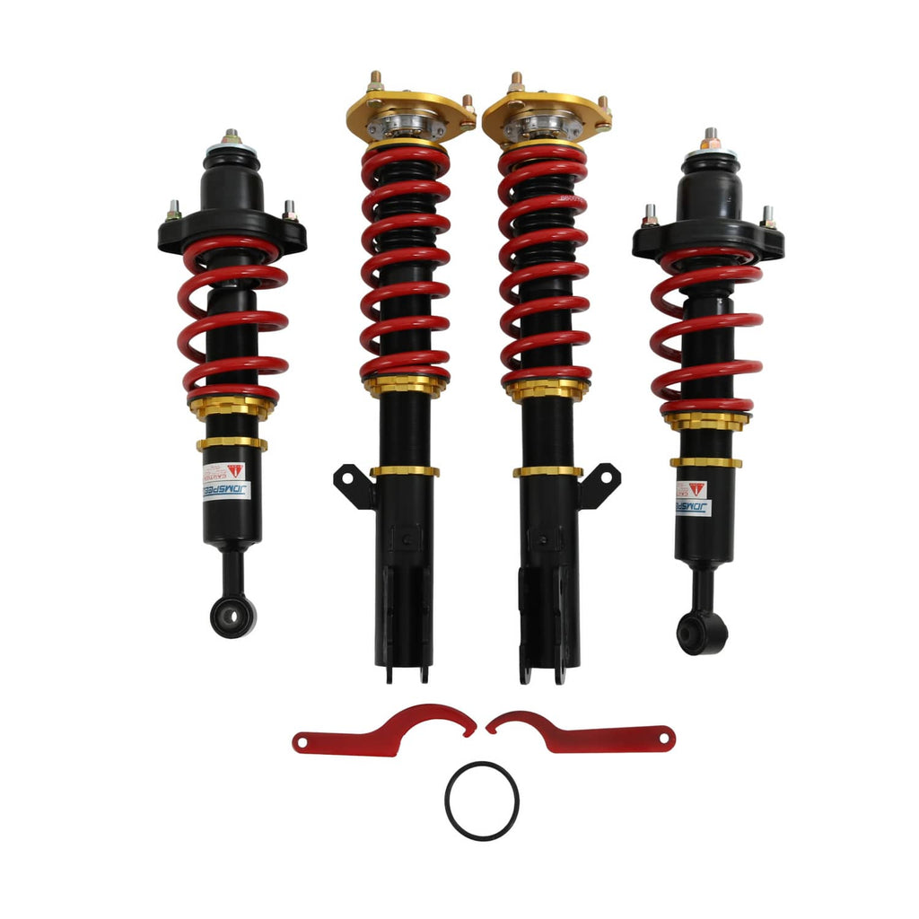 Front and rear coilover struts with red springs, black bodies, and gold top mounts