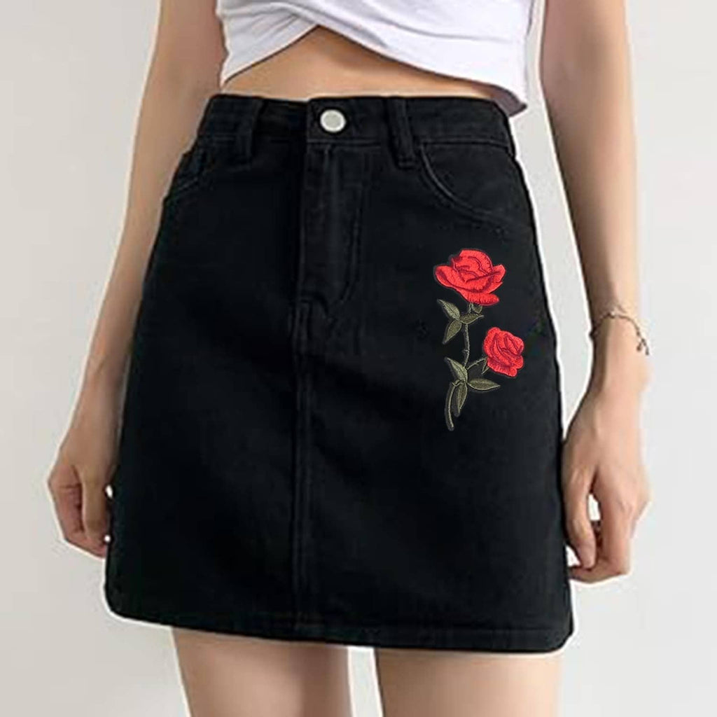 Black denim skirt with embroidered red rose patch on the front