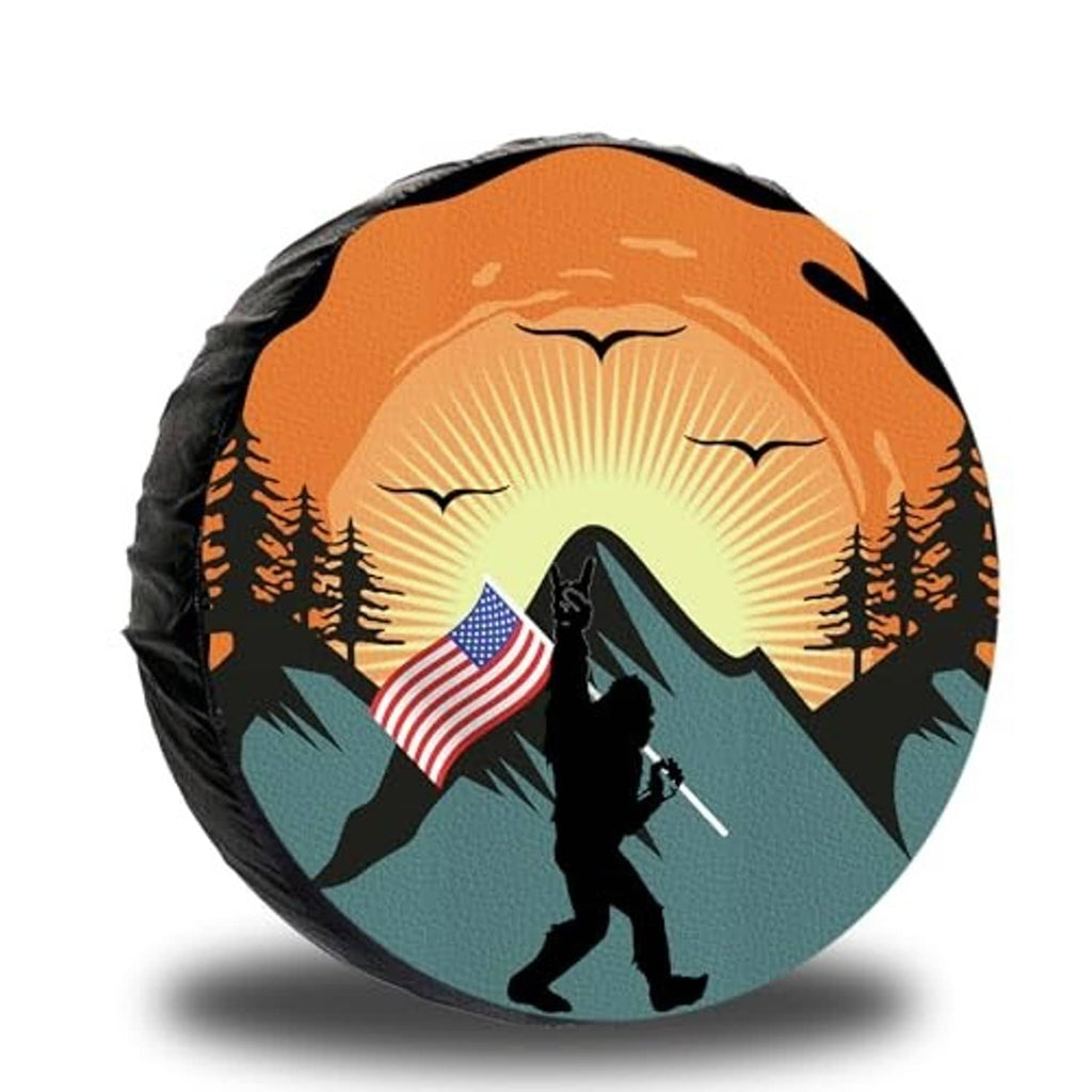 Orange and black spare tire cover with sunburst mountains and hiker with US flag