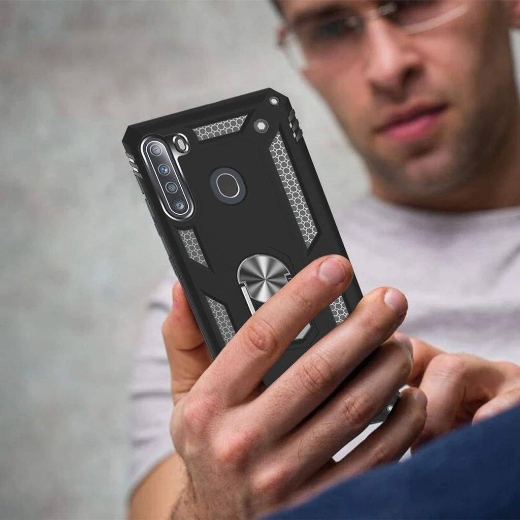 Black rugged phone case with metal ring kickstand held in hand for Galaxy A21