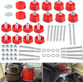 Red polyurethane body cab mount bushings kit with metal sleeves and mounting bolts.