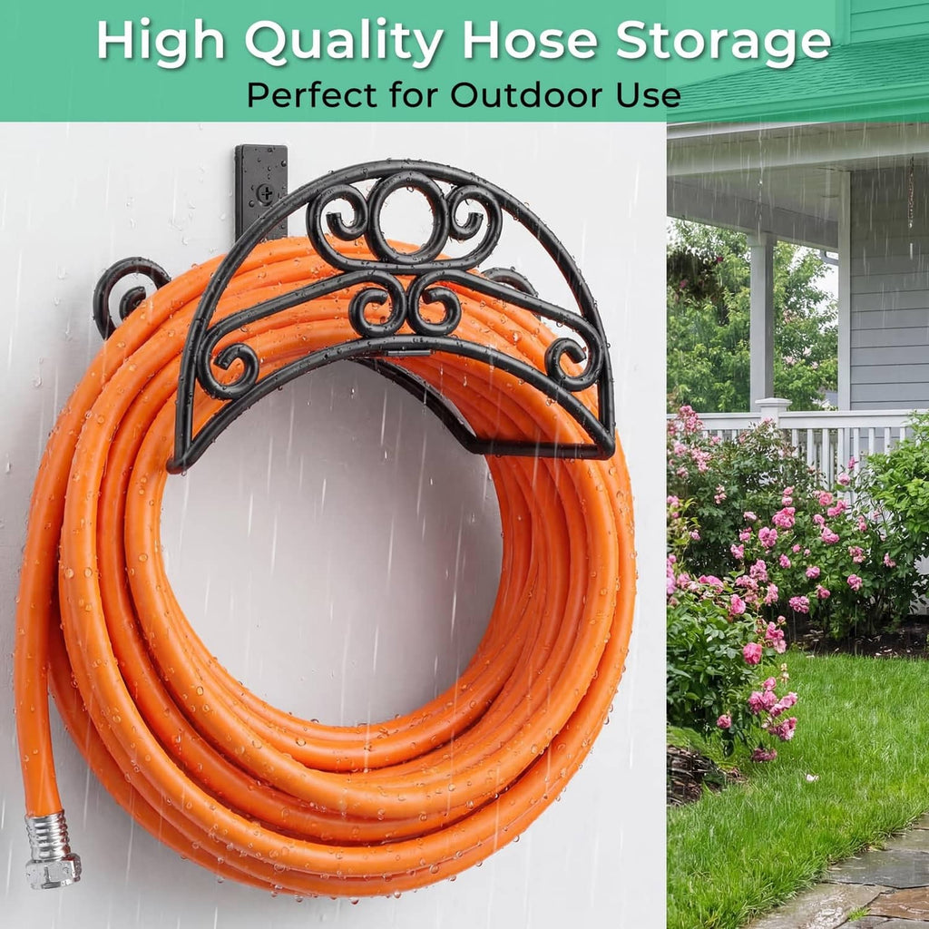 Black wrought-style hose storage rack holding a looped orange garden hose