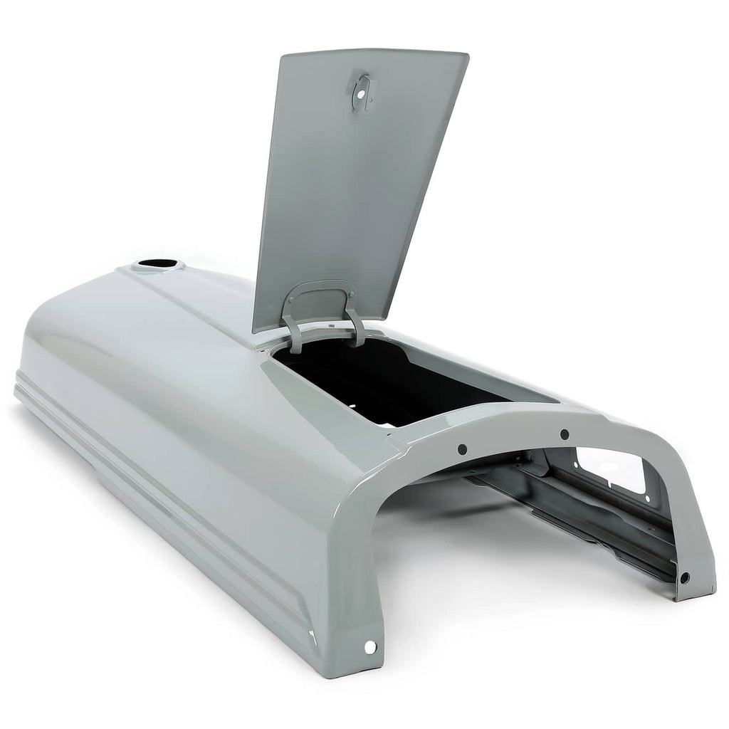 Gray tractor hood with open battery door revealing dark inner area and hinges