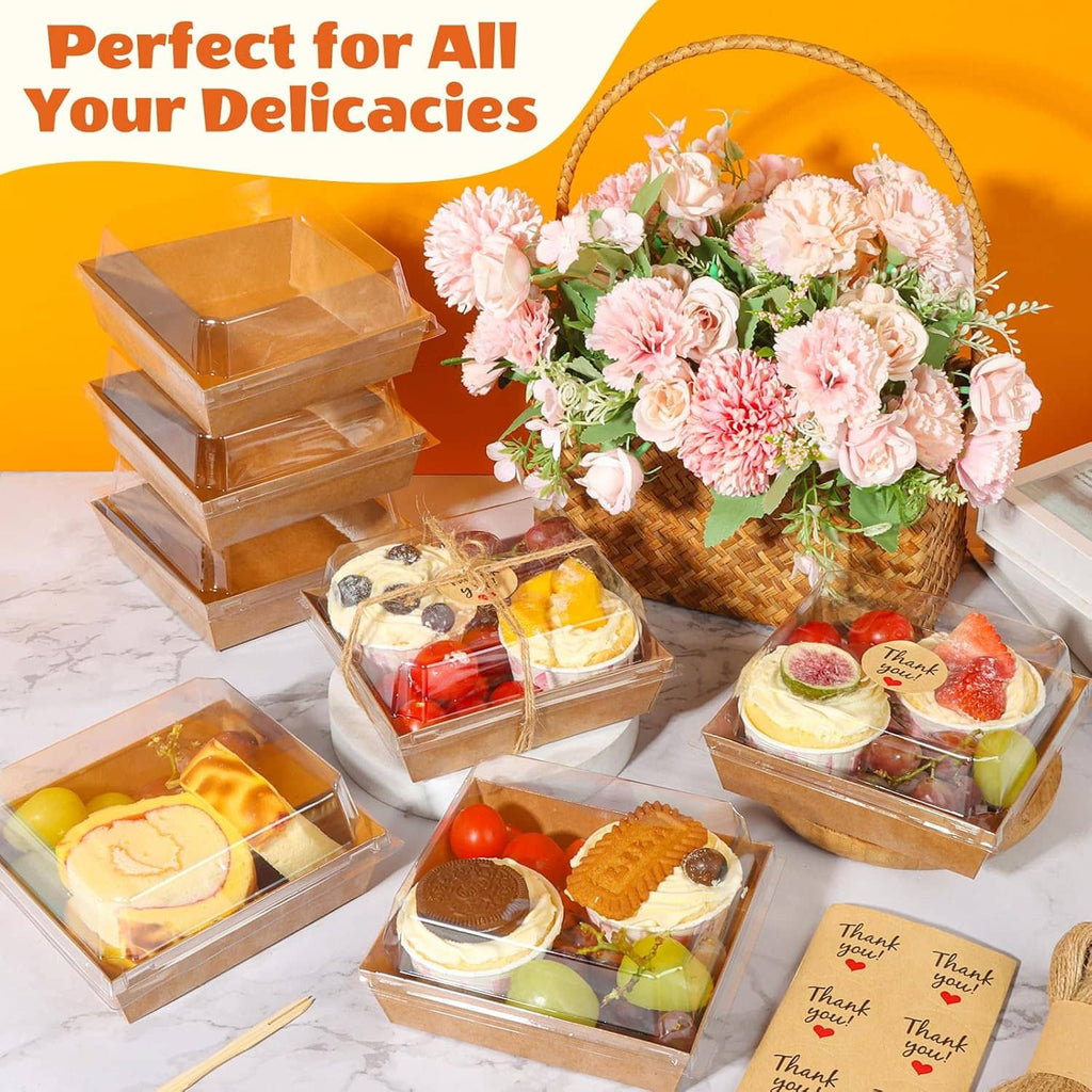 Clear-lidded kraft charcuterie boxes with assorted desserts in a set