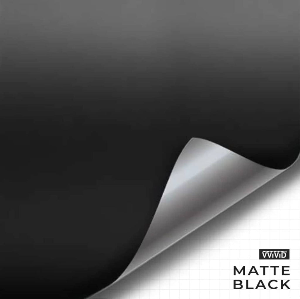 Matte black vinyl tape with curved unroll and white backing liner edge, silver core