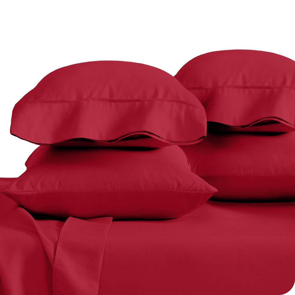 Red microfiber pillowcases with stitched edges, shown in a close stacked view