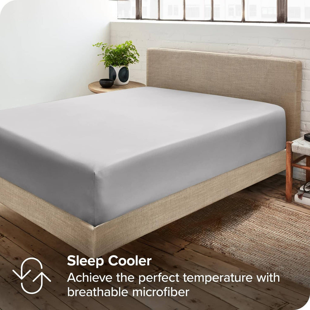 Light grey fitted sheet on a bed with breathable microfiber look