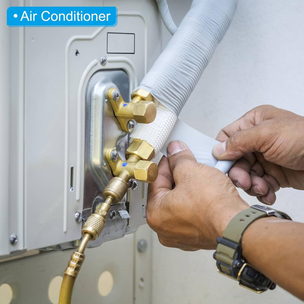 Black foam pipe insulation sleeves on air-conditioner refrigerant lines