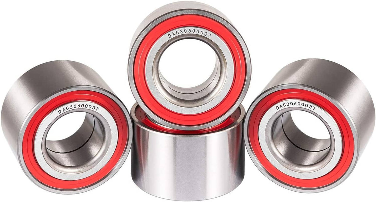Four wheel bearings with red seals and silver housings, front view close-up
