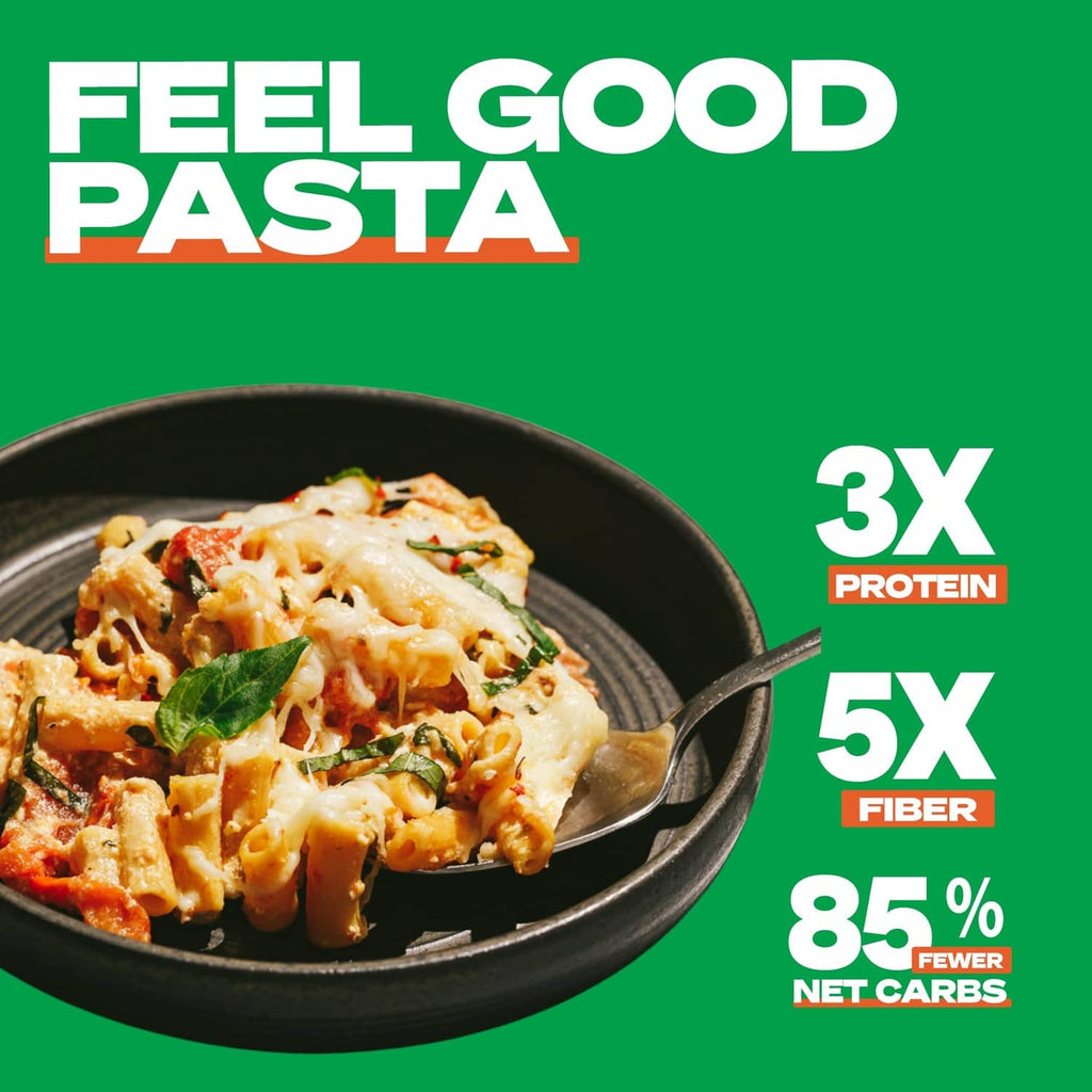 Low carb ziti pasta bowl with melted cheese, marinara sauce, and basil garnish