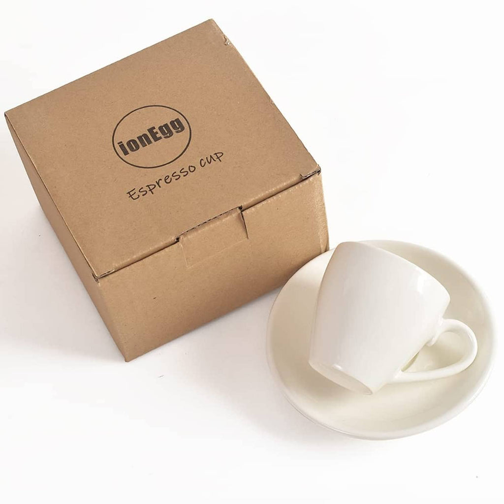 White porcelain espresso cup with saucer, packed in a branded box