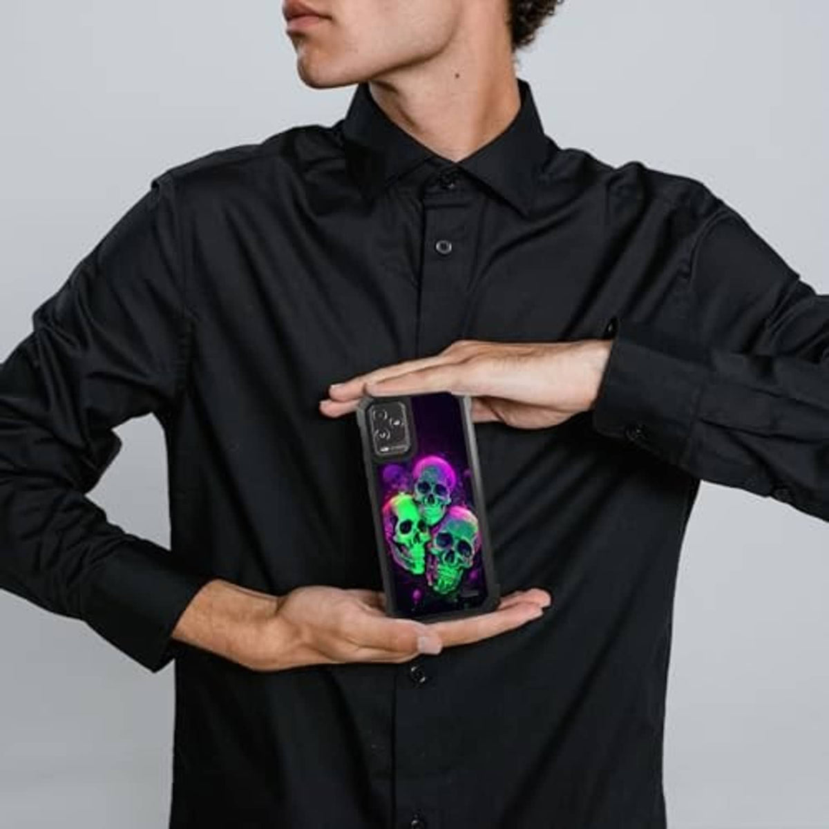 Rugged phone case with neon skull design, camera cutout and grippy dark frame