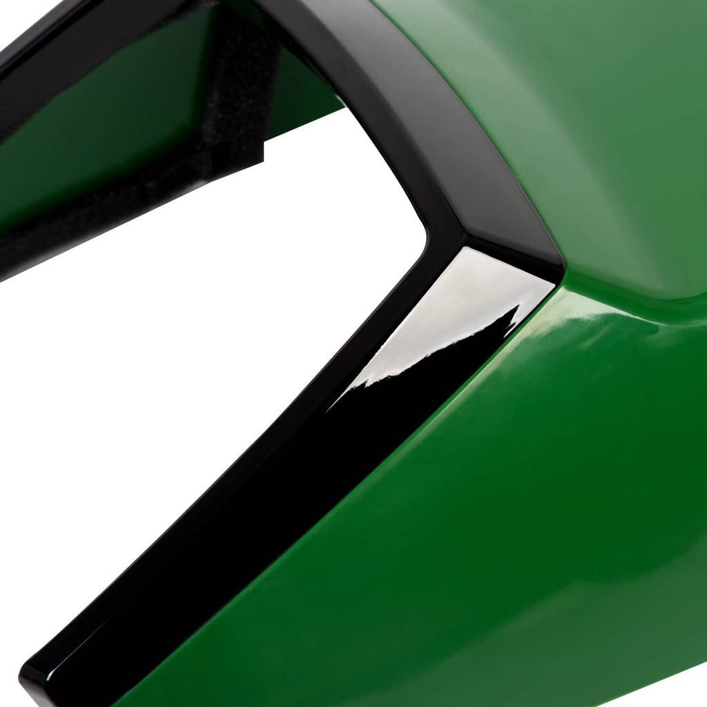 Close-up of hood corner with black trim, vent opening, and mounting details