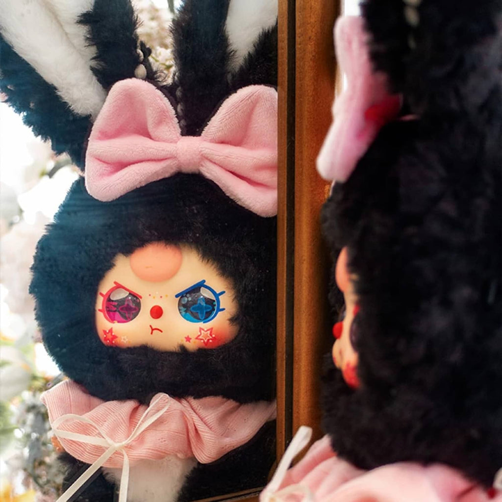 Black rabbit plush blind box figure with pink bow and embroidered face