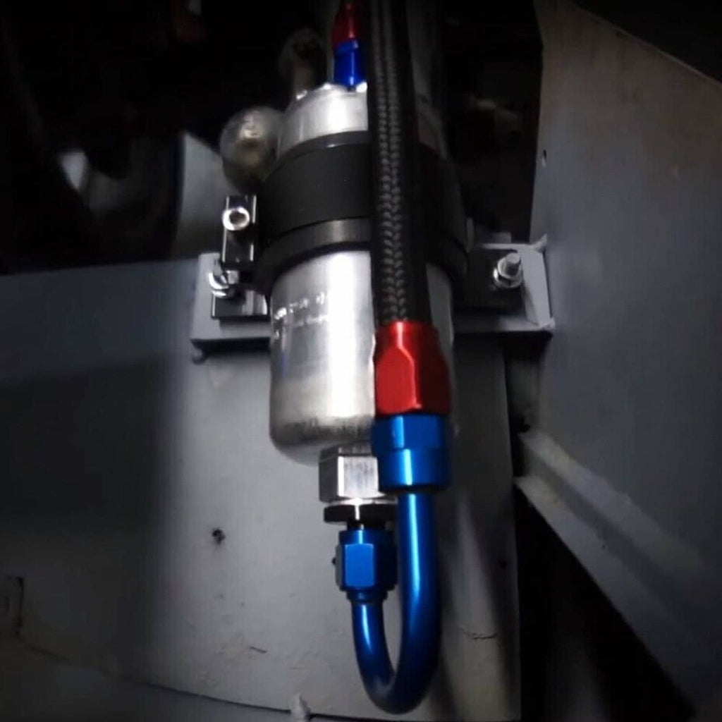 Installed fuel filter mounting bracket with black clamp and metal canister, visible hoses