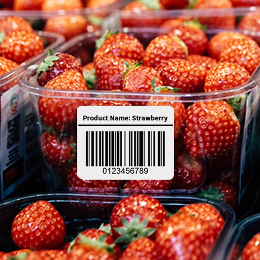 Barcode label sticker on strawberries in a clear plastic container
