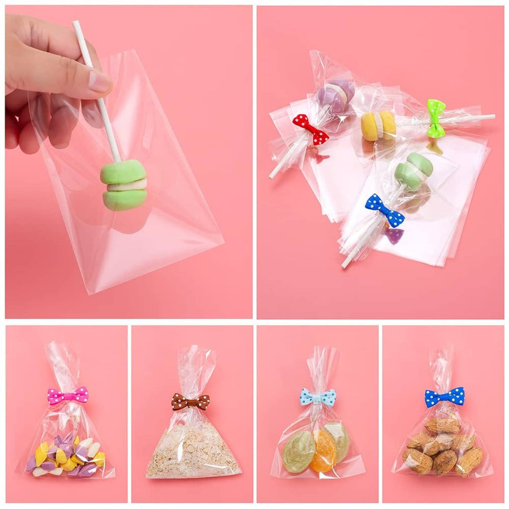 Hand holding a cake pop stick in a transparent wrapper, plus bagged assorted pops