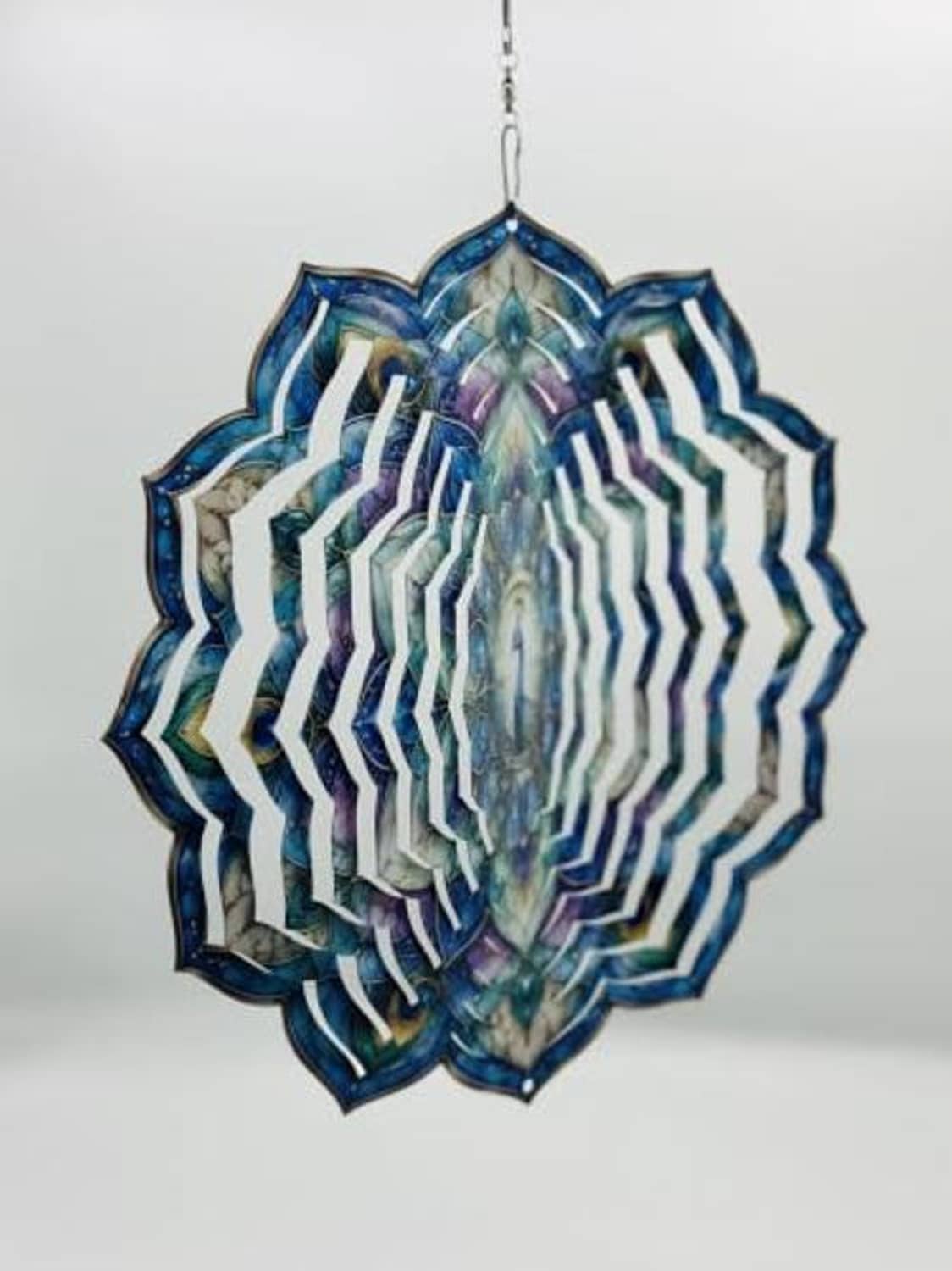 Peacock wind spinner with blue-purple layered feather fan, hanging centerpiece