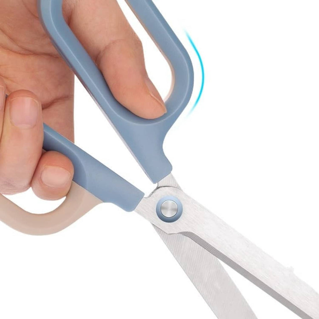 Comfort-grip craft scissors with light blue handle and silver blades, close-up