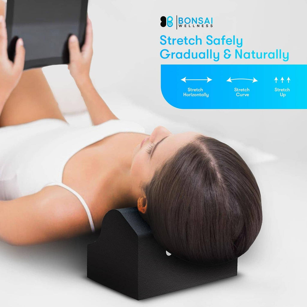 Black cervical traction orthotic foam neck support under head and shoulders