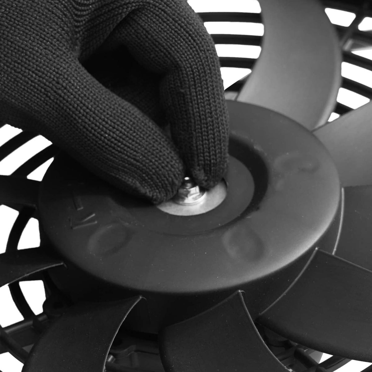 Attic exhaust fan blade and motor housing detail with protective grille